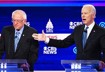Ish Nënkryetari Joe Biden dhe Sen. Bernie Sanders gjatë një debati. (AFP)